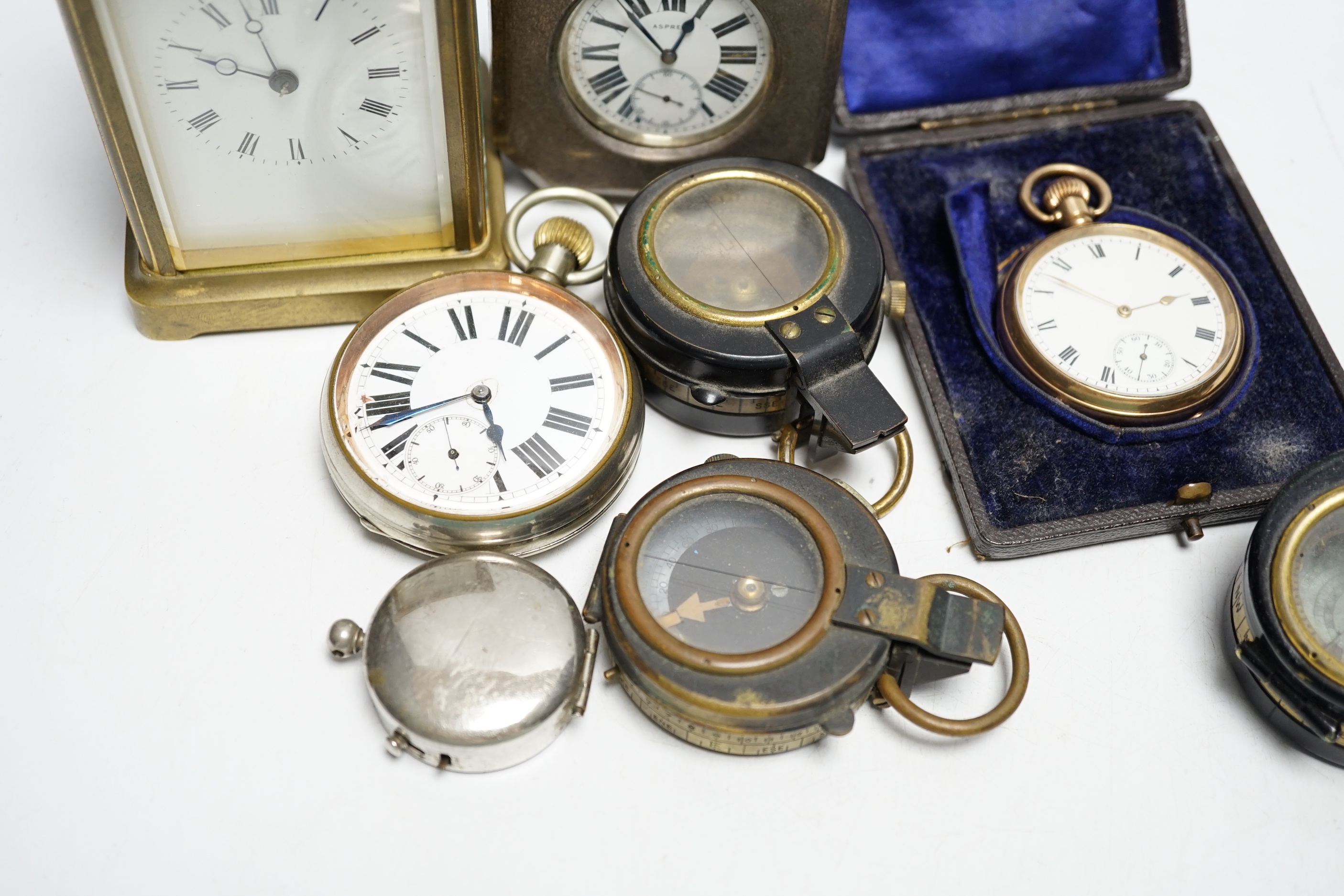 An Asprey pocket watch in silver mounted case, brass cased carriage timepiece, military compasses etc.